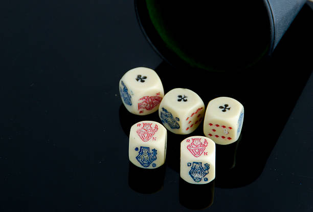 Royal flush and poker chips on white background.