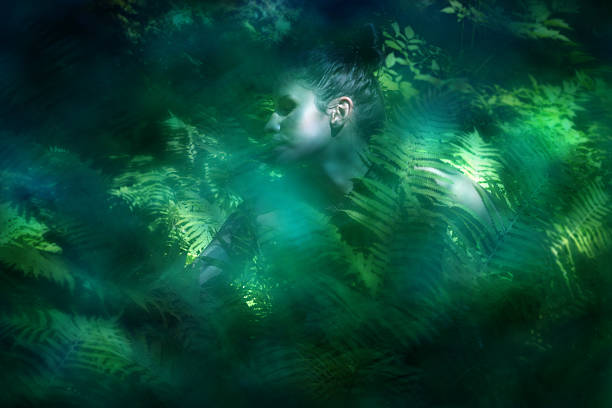 istock Blurry Woman Covered in Fern 2215466570