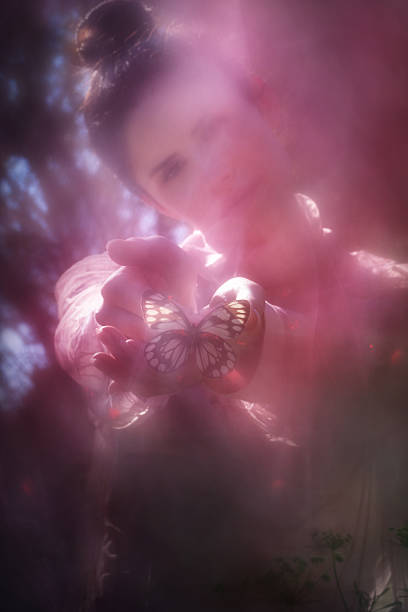 Atmospheric Scene, where a sensitive woman holds aa tropical butterfly, called Delias Diaphana, with red light effects, similar to the ones on the wings.