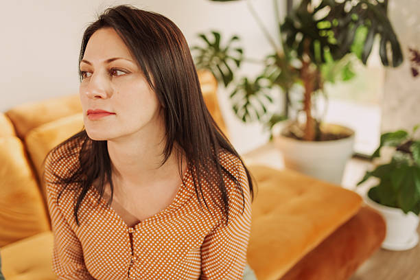 Calm Woman Relaxing on a Cozy Sofa at Home