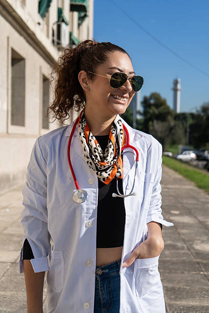 istock Young confident doctor posing outside hospital building 2215484299