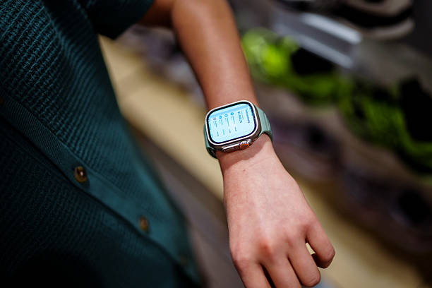 istock Teenage boy using digital wallet app on his smart watch 2215486382