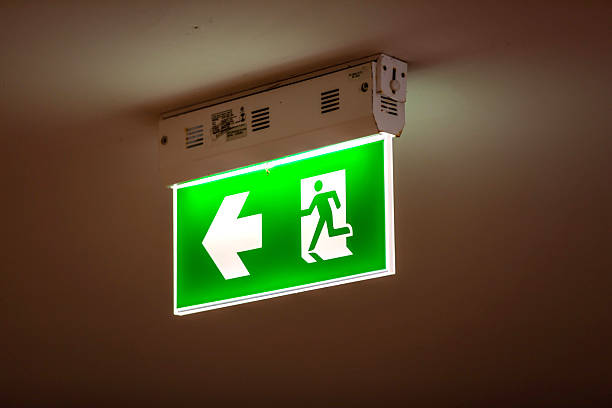 istock Fire exit sign along a building corridor, ensuring safety and guidance, perfect for interior, emergency, and safety themes. 2215486552