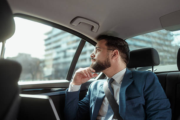 istock Businessman Working on Laptop in Car 2215487303
