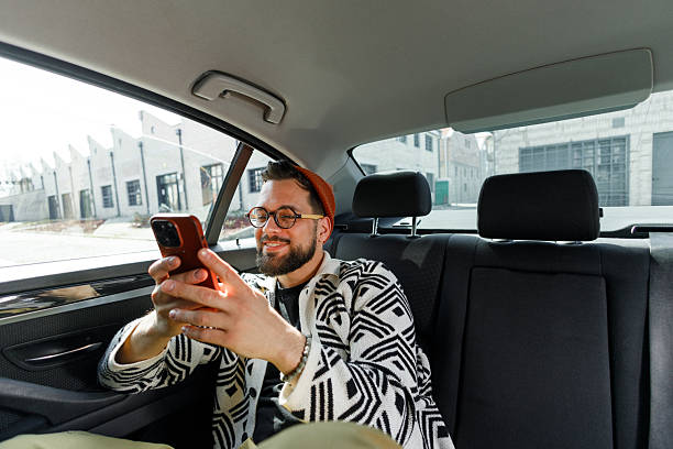 istock Man Having Video Call in Car Backseat 2215487309