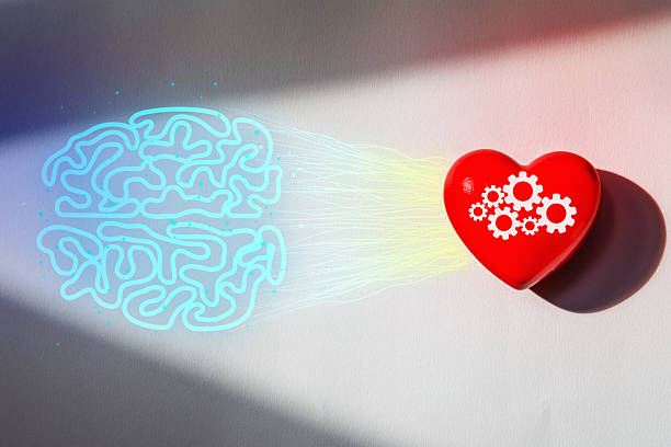 Inspiring abstract digital art featuring a blue brain connected to a red heart with white gears by light effects on a gray background, symbolizing creativity, new thinking