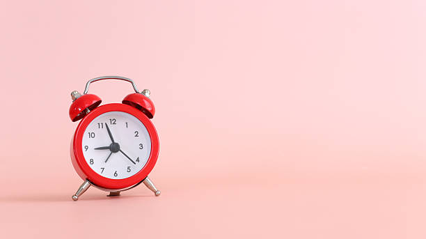 istock Red vintage clock on pink pastel background 2215493062