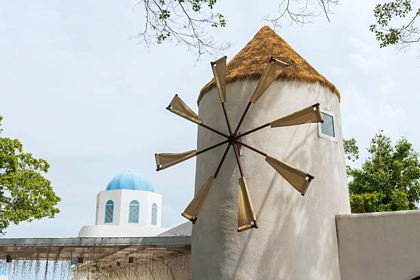 Windmill attached in modern building as restaurant bybeach, Chonburi, Thailand