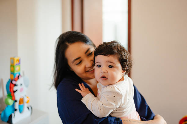 istock Mother comforting baby indoors 2215496785