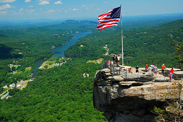 Chimney Rock State Park, NC, USA May 29 People enjoy the view from the top of Chimney Rock State Park, North Carolina, taking in the lush green landscape