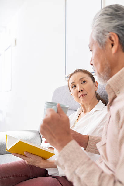 istock asian senior age couple who reads a book, 2215497241