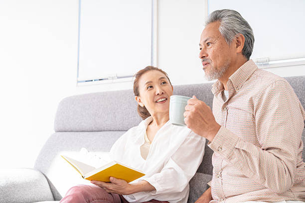 istock asian senior age couple who reads a book, 2215497255