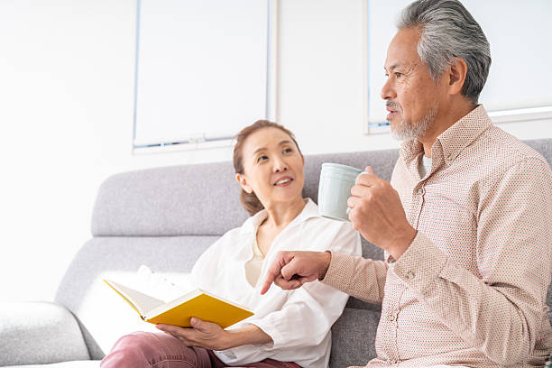 istock asian senior age couple who reads a book, 2215497275