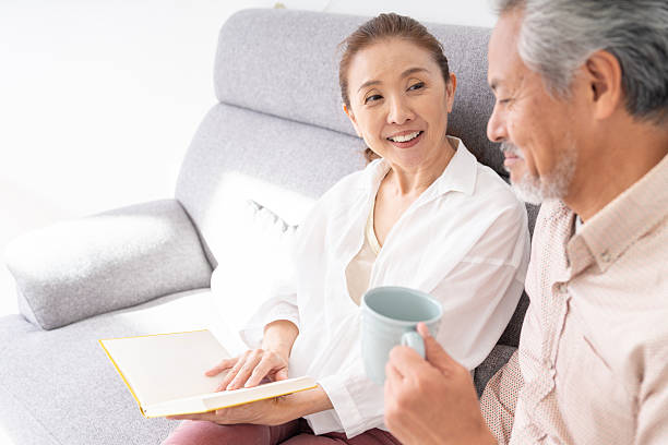 istock asian senior age couple who reads a book, 2215497286