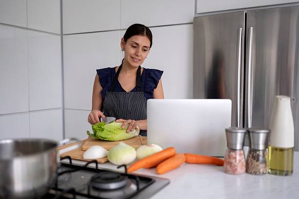 istock Woman taking online cooking class 2215498076