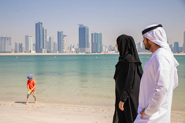 istock Middle Eastern couple is talking and having fun at the beach. 2215499585