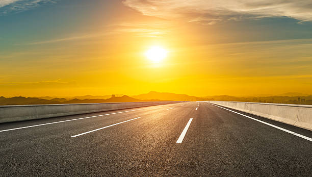 istock Asphalt road and mountain with beautiful sky clouds at sunset 2215501248
