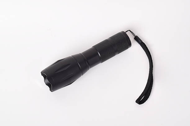 istock Modern metal LED flashlight in black color 2215502694