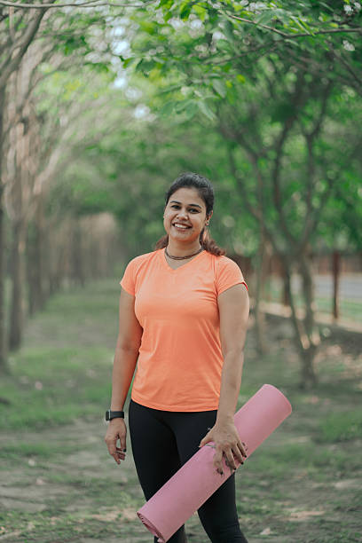 istock Fitness woman holding a mat 2215503364