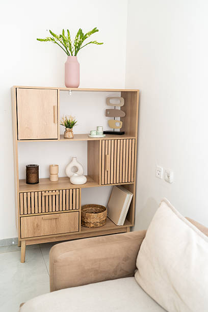 istock Modern Wooden Shelf With Decor and Plants in a Cozy Interior 2215507191