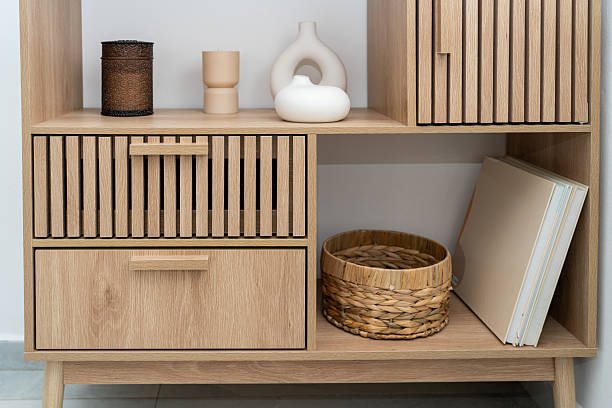 istock Modern Wooden Storage Unit With Decorative Items in a Bright Room 2215507409