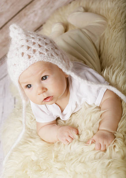 Adorable  baby boy in white hat