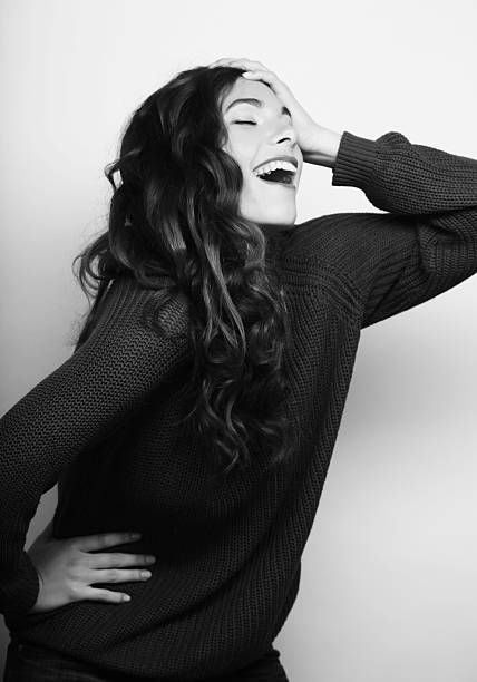 Beautiful young surprised woman. Studio shot.