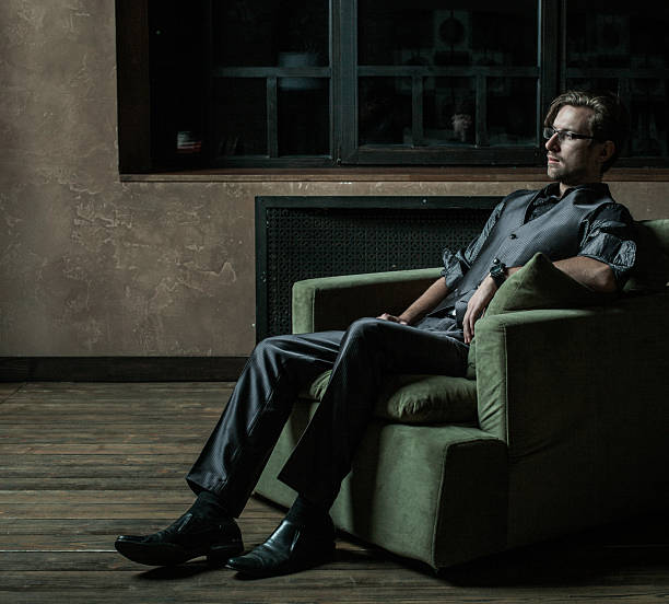 istock Businessman sitting on an armchair 2215511876
