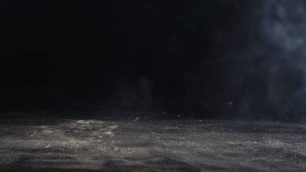 istock black background with white sand and light smoke 2215512901