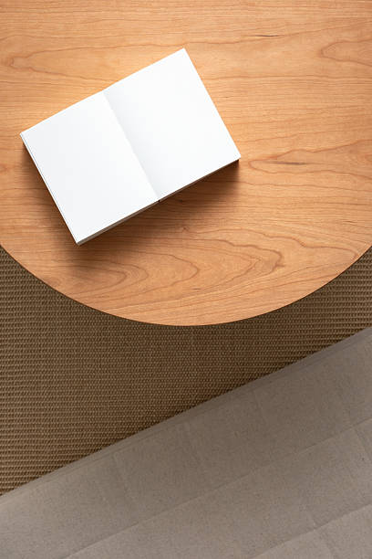 istock Blank note paper on wooden table. Blank paper on wooden background. Blank notebook on cherry wood desk. 2215513061