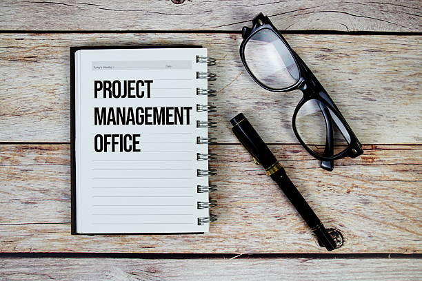 istock Project Management Office (PMO) text on notepad, Business and Financial concept background 2215513463