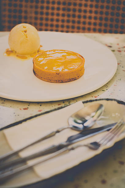 istock Lemon Tart Served with vanilla ice cream on a white plate 2215514381