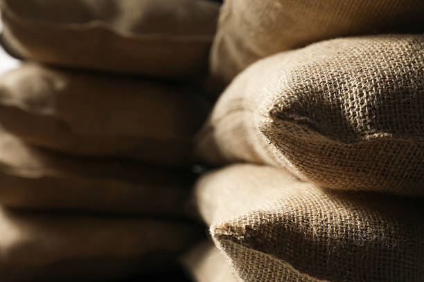 istock Closeup view of many natural burlap sacks 2215514531