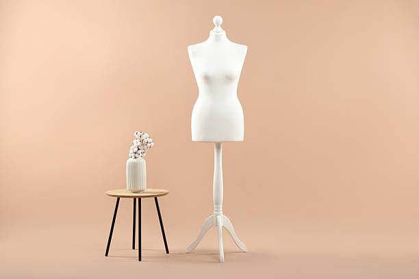 istock Mannequin and stylish vase on beige background 2215515687