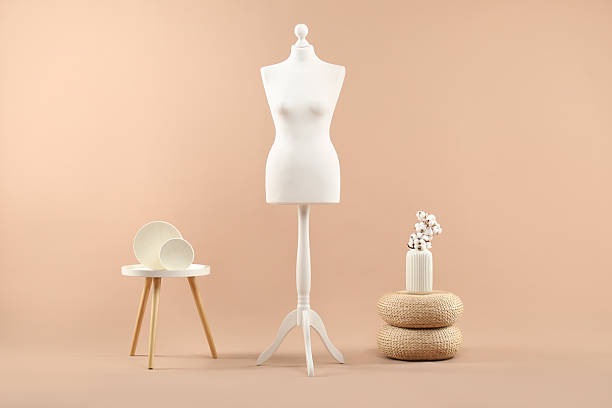 istock Female mannequin and vase on beige background 2215515728