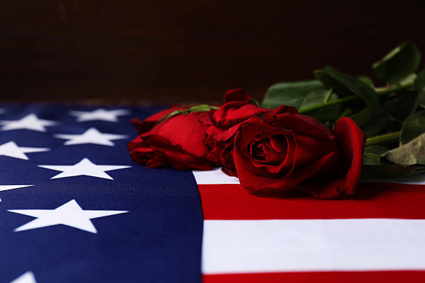 istock Veterans day. American flag and roses, closeup 2215515741