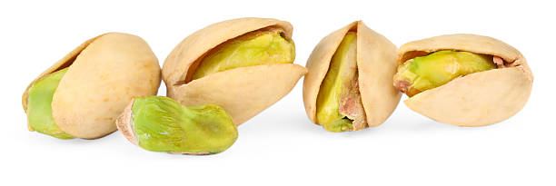 istock Many tasty pistachio nuts isolated on white 2215516686