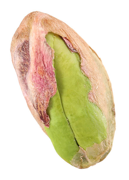 One peeled pistachio nut isolated on white