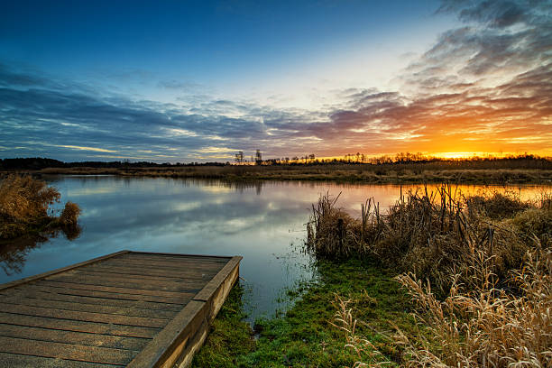 istock Beautiful sunrise over river banks 2215518218