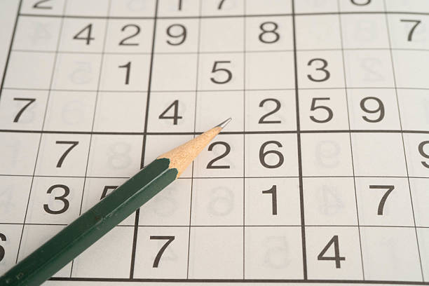 istock Sudoku puzzle, game to play for keep you brain younger for developing Alzheimer disease in senior patient. 2215518483