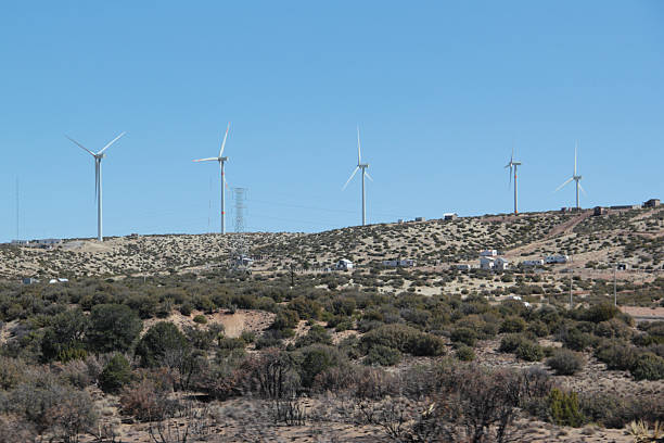 istock Wind turbine, or wind generator is a device that converts the kinetic energy into non-polluting electricity, on the road 2215518814