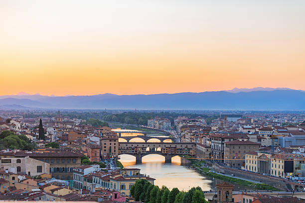istock Cityscape view at Florence in evening light with  Ponte vecchio bridge over Arno river 2215520029