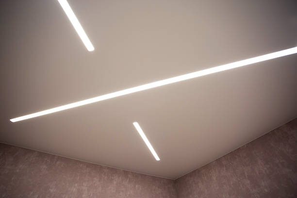 istock Modern stylish stretch ceiling with LED light lines. Designer geometric ceiling 2215520803