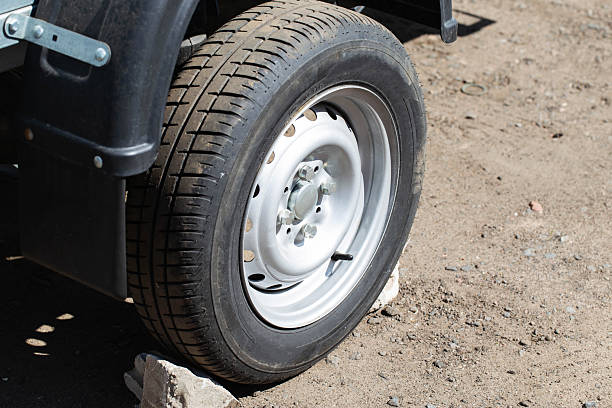 istock New wheel with tire and mudguard on trailer, close-up. Copy space for text 2215520969