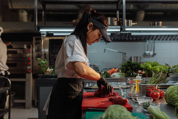 istock Professional chef cutting red meat in a commercial kitchen 2215521176