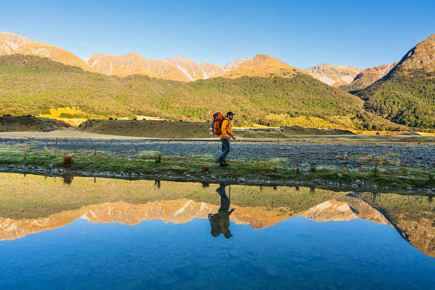 istock Traveler hiking by the water. 2215521240