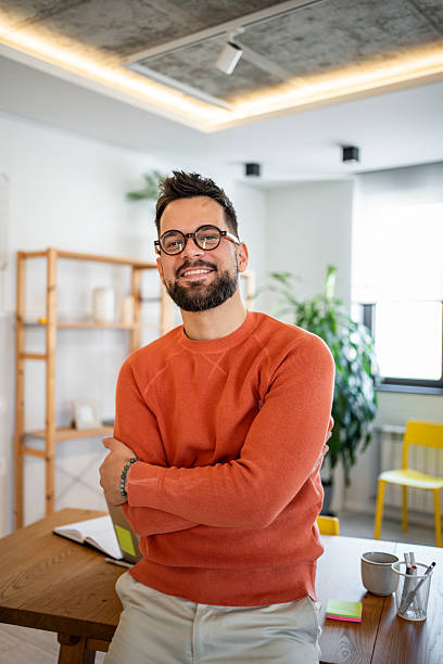 istock Portrait of smiling freelancer working from home office 2215531726