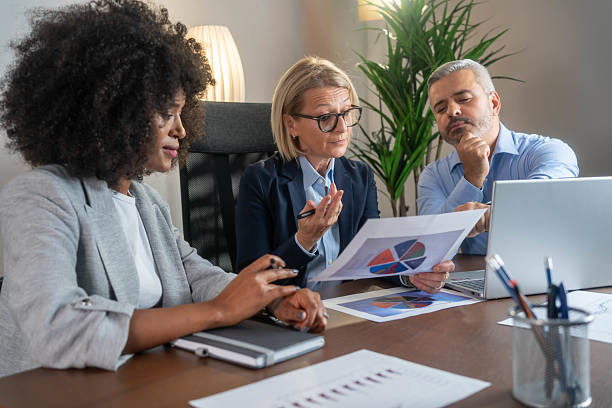 istock Group of business persons talking in the office. 2215535137