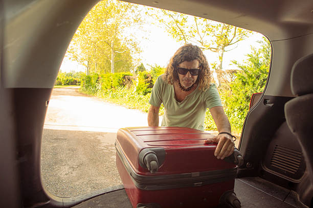 istock Latino man with his car 2215535556