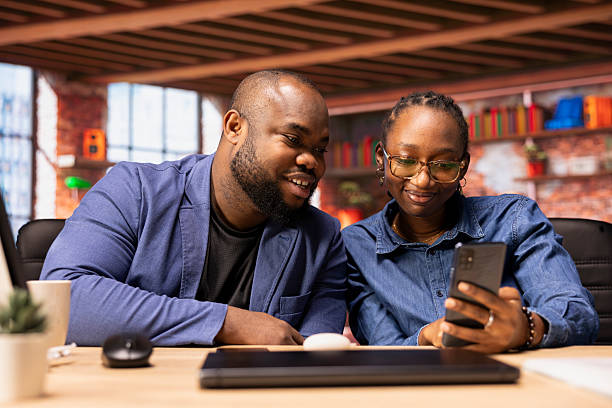 istock Young couple checking their email inbox before starting daily freelance work 2215536873